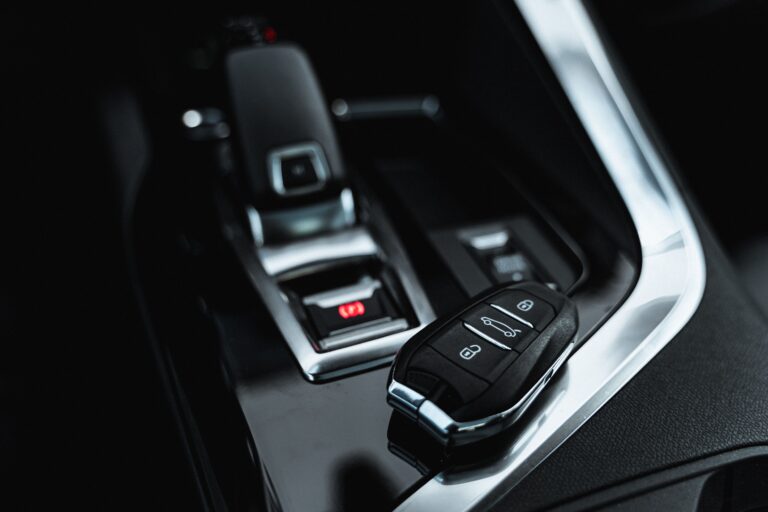 2018 Honda Accord smart key fob resting on center console showing keyless entry push button start system