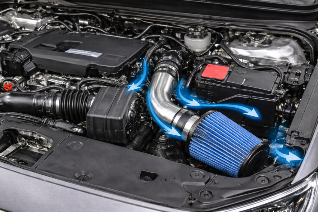 Cold air intake installed in Honda Accord V6 engine bay showing does cold air intake add power to V6 with improved airflow design.